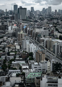 High angle view of modern buildings in city against sky