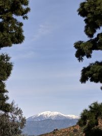 Scenic view of snow covered mountain against sky