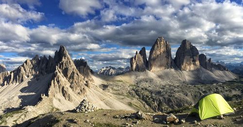 Scenic view of mountains against cloudy sky