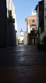 Narrow walkway leading to building