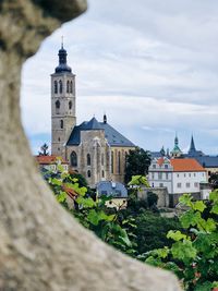 Buildings in town against sky