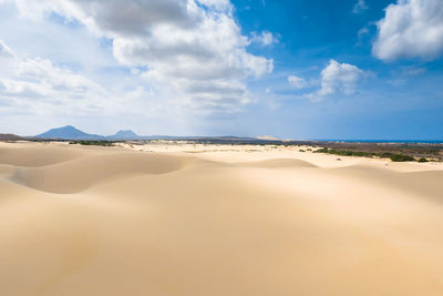 Panoramic view of desert against sky