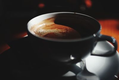 Close-up of coffee cup on table