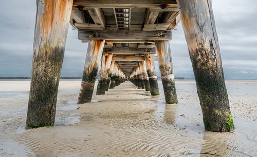 Pier over sea against sky