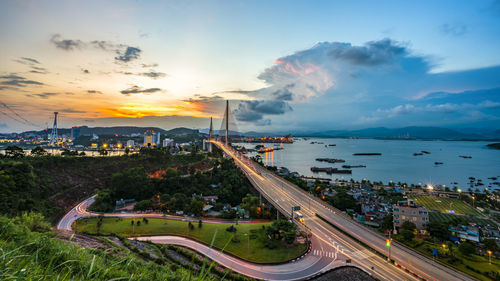 High angle view of city street against sky during sunset