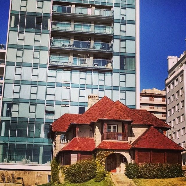 building exterior, architecture, built structure, window, city, residential building, residential structure, building, blue, apartment, facade, clear sky, low angle view, house, day, modern, exterior, outdoors, residential district, balcony