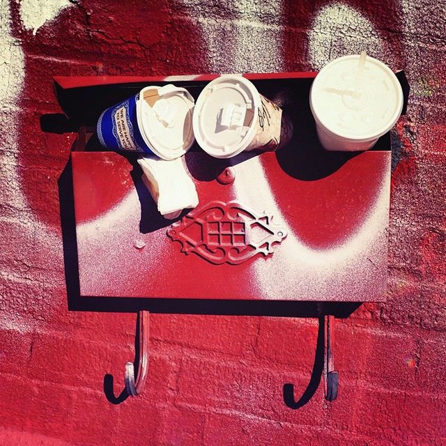 indoors, still life, table, high angle view, variation, wood - material, no people, red, equipment, coffee cup, old-fashioned, food and drink, close-up, directly above, wall - building feature, absence, drink, metal, art and craft, container