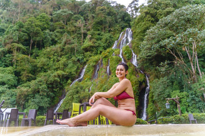 Young woman sitting on mountain