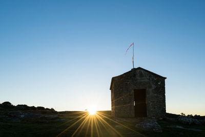 Old hunter's hut on the mountain at sunset. alto da groba - baiona - spain