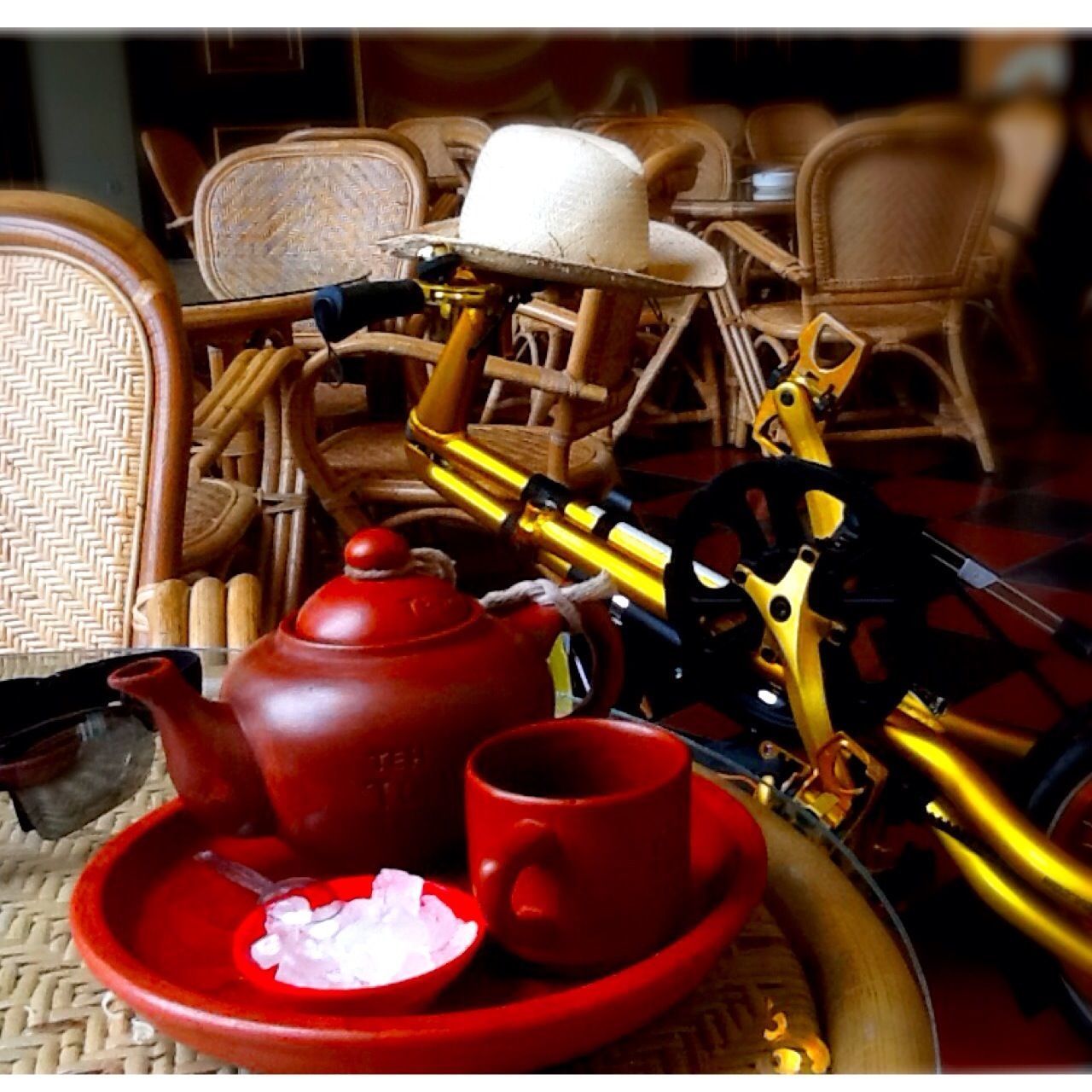 indoors, red, chair, table, illuminated, no people, still life, arrangement, absence, in a row, large group of objects, close-up, old-fashioned, empty, decoration, antique, lighting equipment, restaurant, day, abundance
