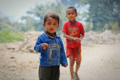 Portrait of boy standing outdoors