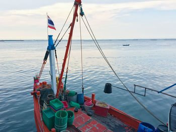 Cropped image of boat in sea against sky