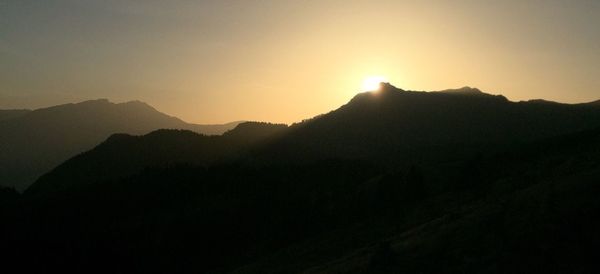 Scenic view of mountains at sunset