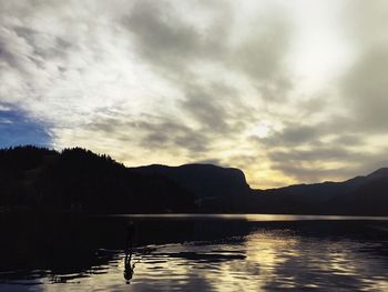 Scenic view of silhouette mountain against sky at sunset