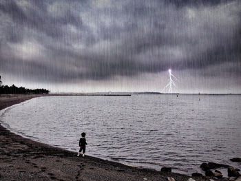 Scenic view of sea against cloudy sky