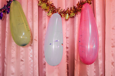 Close-up of balloons on curtain