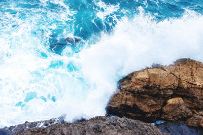 Waves splashing on rocks