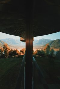 Scenic view of field seen through window