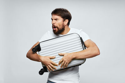 Man standing against white background