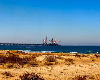 Scenic view of sea against blue sky