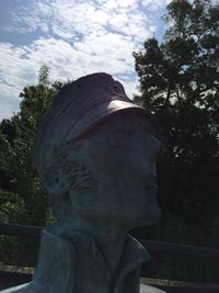 Low angle view of statue against cloudy sky