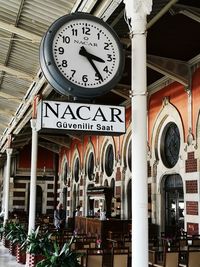 Low angle view of clock sign on building