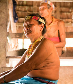 Mid adult woman sitting outdoors