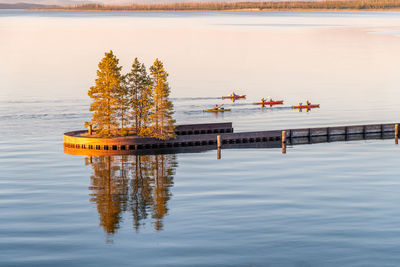 Scenic view of swimming pool by lake against sky