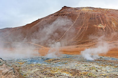 Impressive mt namafjall looming over the hverir thermal area in northern iceland