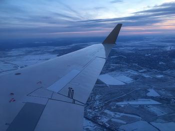 Aerial view of snowcapped mountain against sky