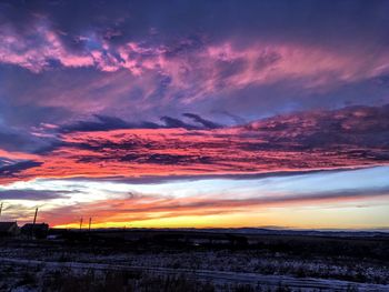 Scenic view of dramatic sky over land