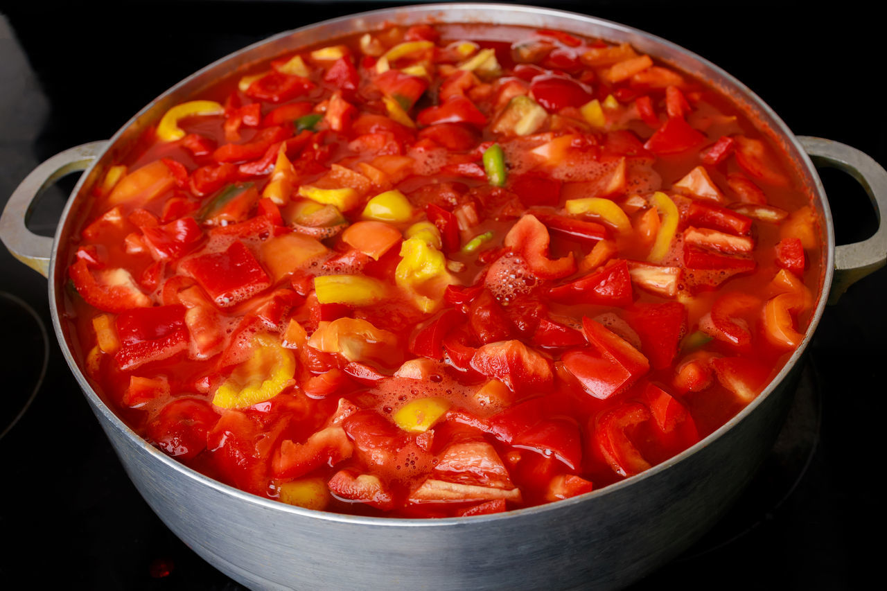 food and drink, food, healthy eating, vegetable, produce, freshness, fruit, red, wellbeing, dish, indoors, pepper, tomato, cooking pan, household equipment, no people, black background, studio shot, kitchen utensil, spice, close-up, high angle view, chili pepper, vegetarian food