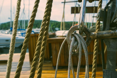 Close-up of ropes tied on metal