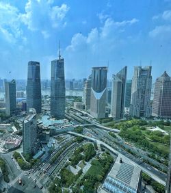 High angle view of buildings in city against sky