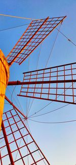 Low angle view of tower against blue sky