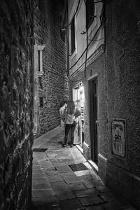 Woman standing in front of building