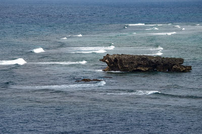 View of rock in sea