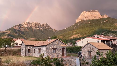 Panoramic view of buildings and mountains against sky