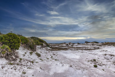 Scenic view of land against sky during winter