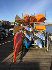 Multi colored umbrellas in city against sky
