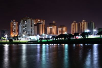 Illuminated buildings in city at night