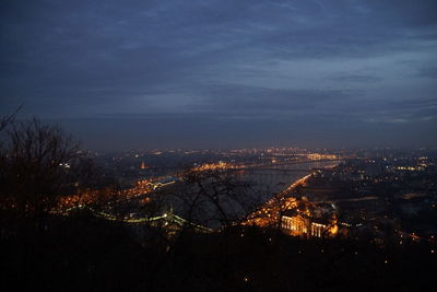 High angle view of illuminated cityscape against sky