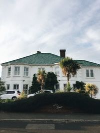 Building by road against sky