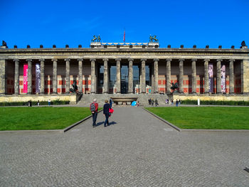 Group of people in front of historical building