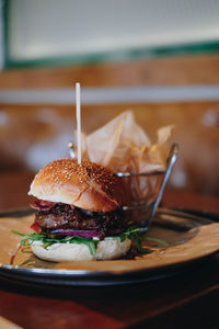 Close-up of burger in plate on table