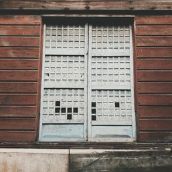 Close-up of window on brick wall