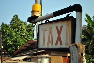 Low angle view of taxi sign