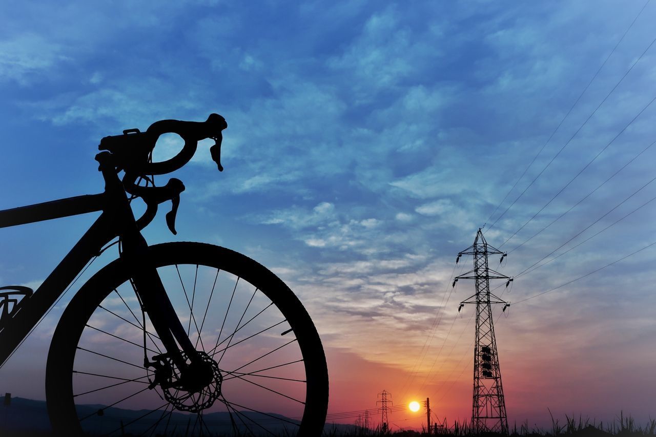 SILHOUETTE BICYCLE AGAINST SKY DURING SUNSET