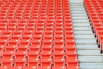 Low angle view of orange bleachers at stadium