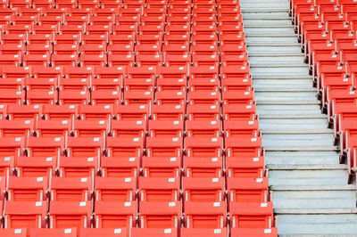 Low angle view of orange bleachers at stadium